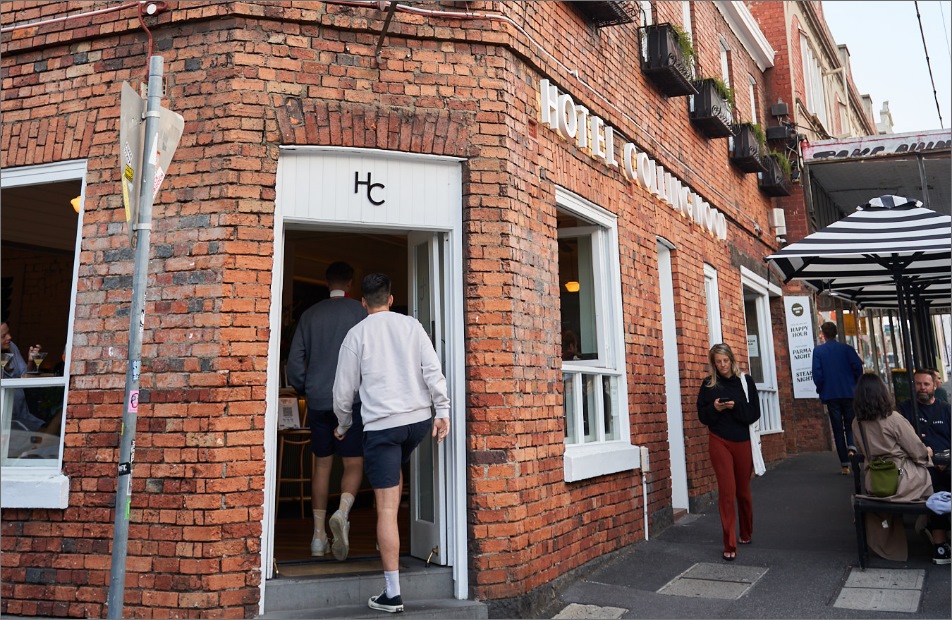 Man walking into Hotel Collingwood