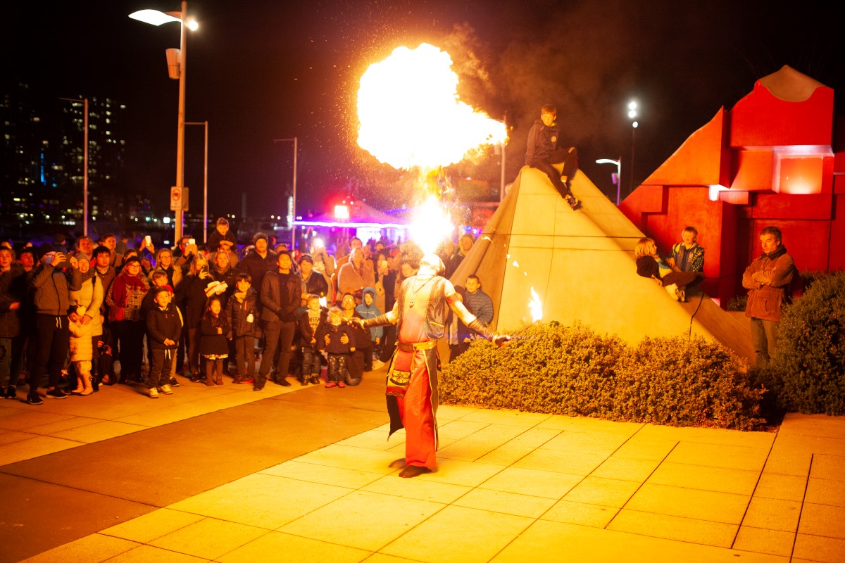 Man blowing fire out of mouth. Melbourne Firelight Festival